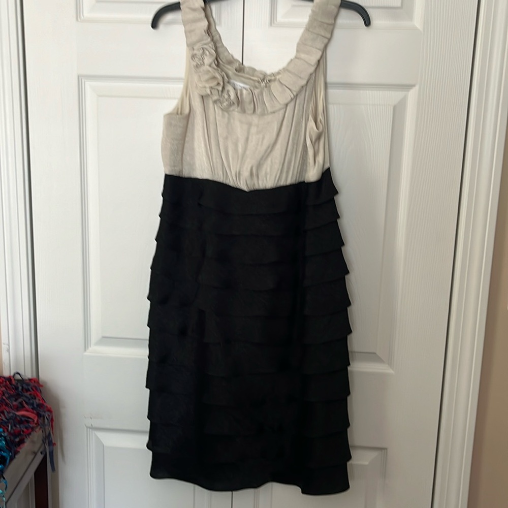 Festive dress for a wedding or holiday party. Black and shiny cream.